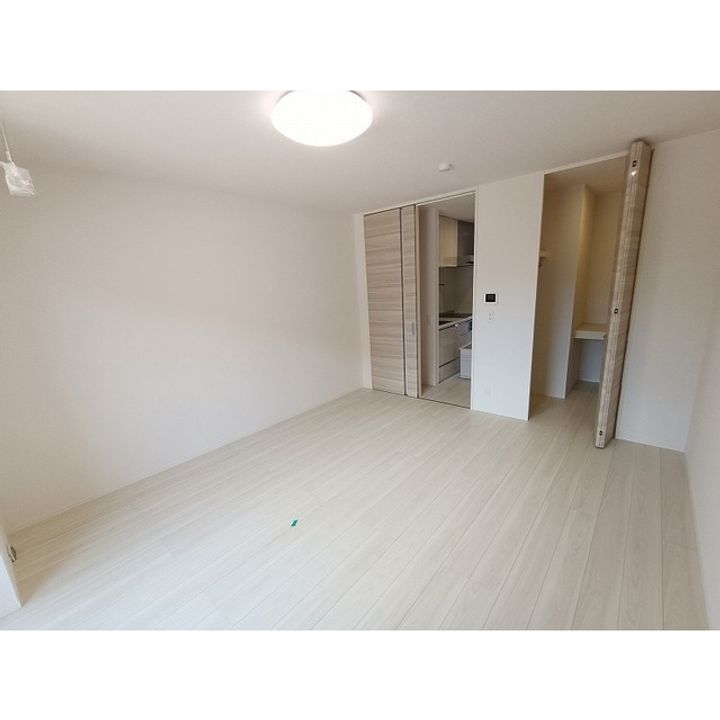 コンフォーティア諏訪豊田 B棟107の居間