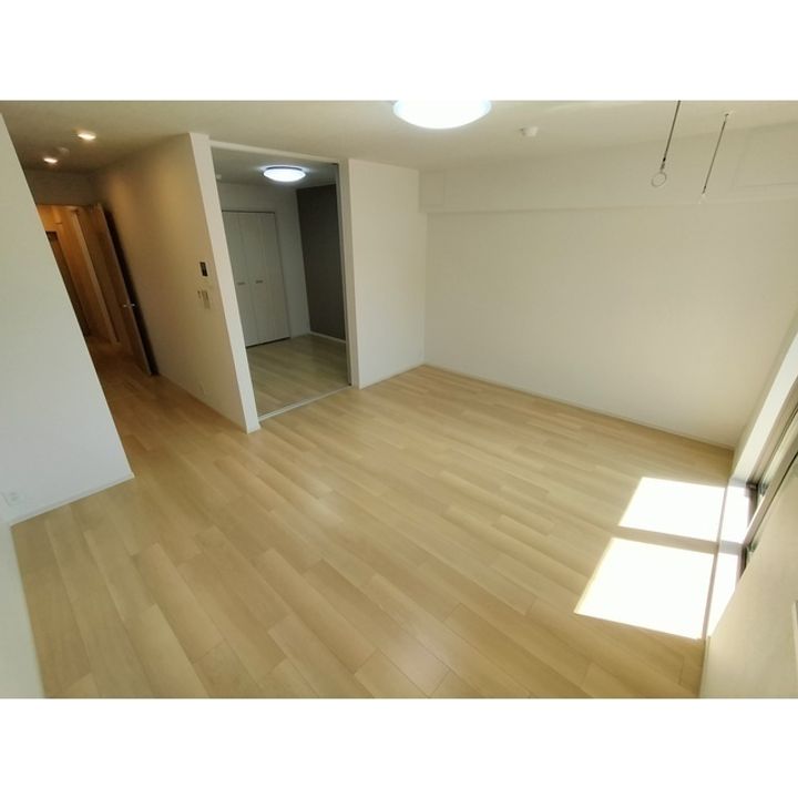 コンフォーティア南箕輪Ⅱ A棟202の居間