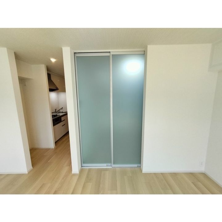 コンフォーティア南箕輪Ⅱ A棟202の居間