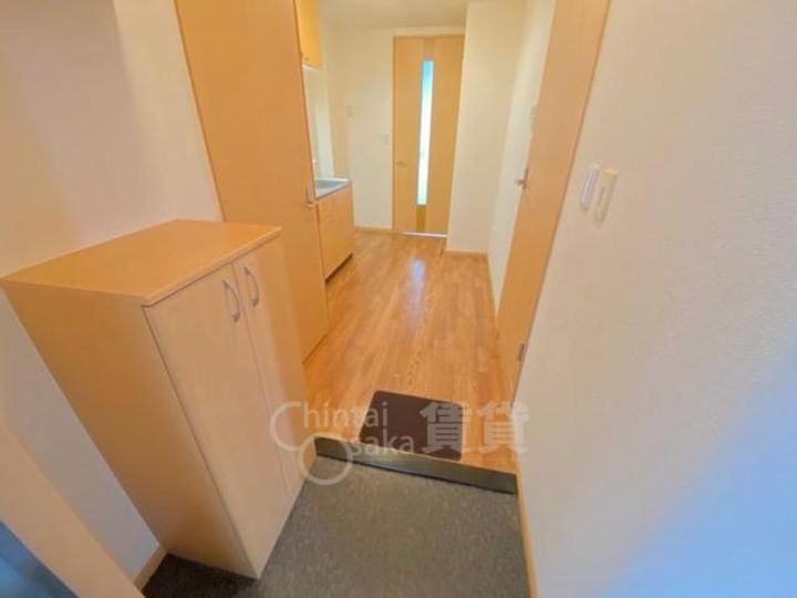 大阪府箕面市彩都粟生南2丁目の賃貸マンションの玄関