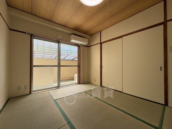 大阪府大阪市東淀川区豊新4丁目の賃貸マンションの居間