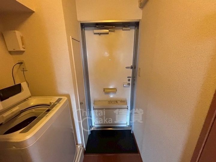 大阪府摂津市別府1丁目の賃貸マンションの玄関