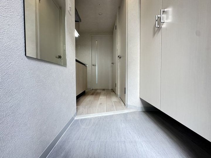 ファーストフィオーレ吹田レガーメの玄関