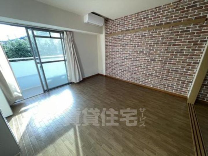 大阪府堺市北区中百舌鳥町1丁の賃貸マンションの居間