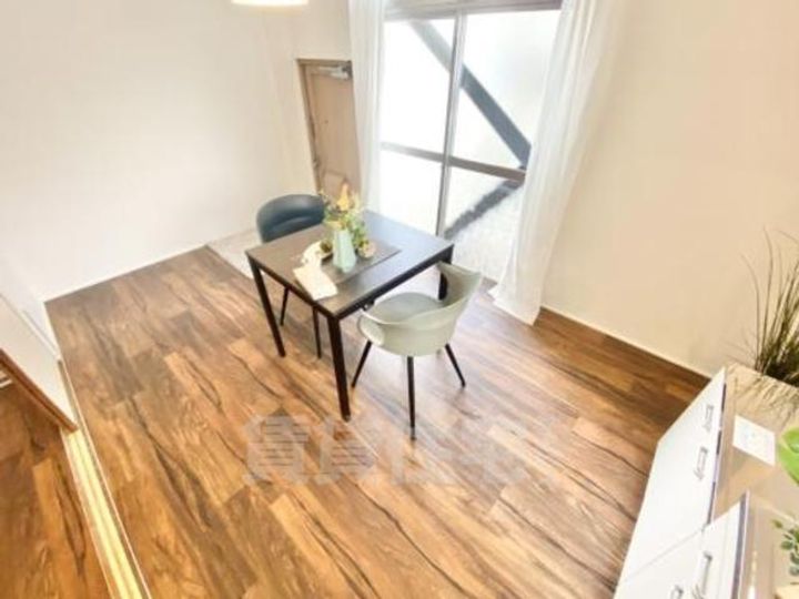 大阪府茨木市北春日丘3丁目の賃貸マンションの居間