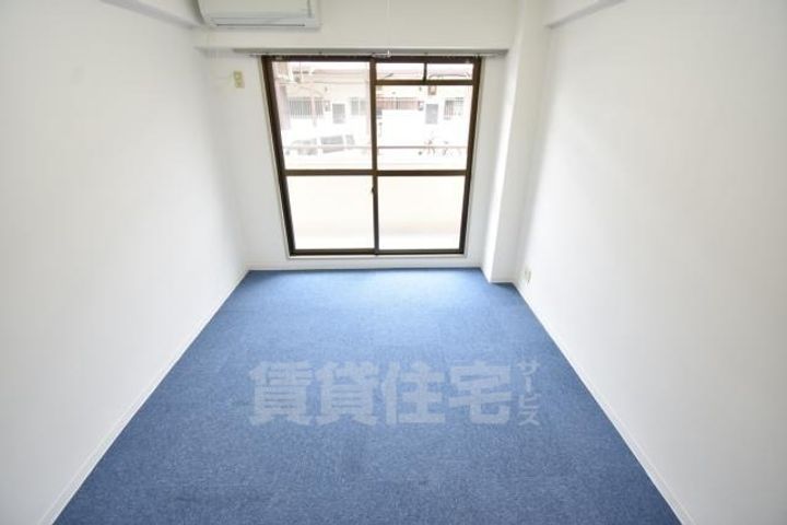 大阪府堺市北区東三国ヶ丘町5丁の賃貸マンションの居間