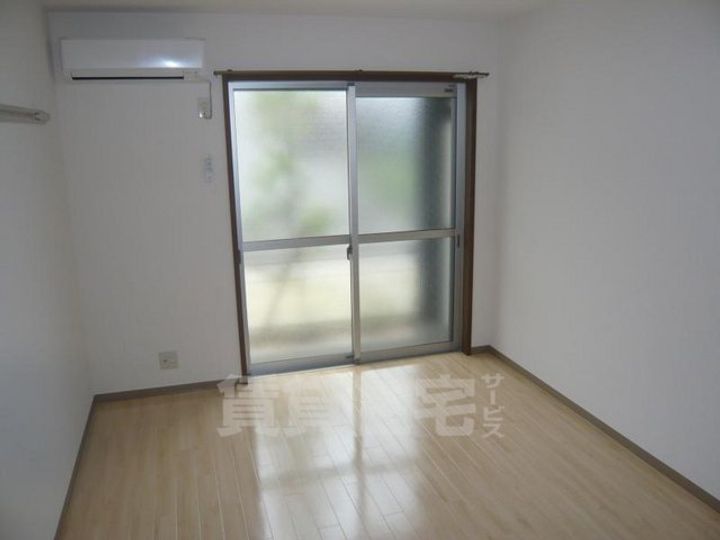 大阪府堺市西区鳳東町7丁の賃貸アパートの寝室