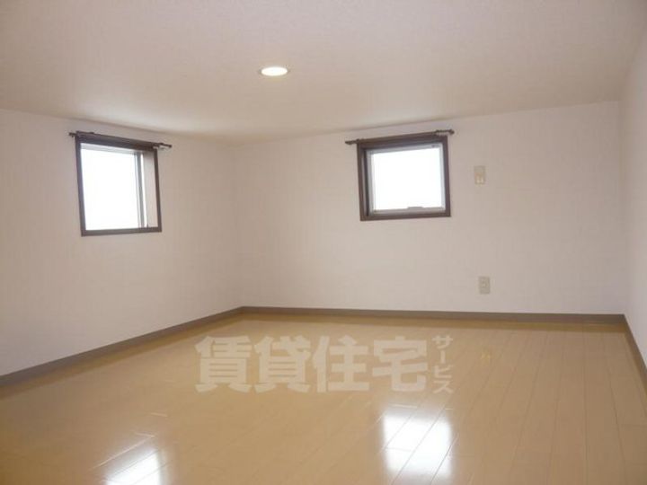 大阪府堺市西区鳳東町7丁の賃貸アパートの居間