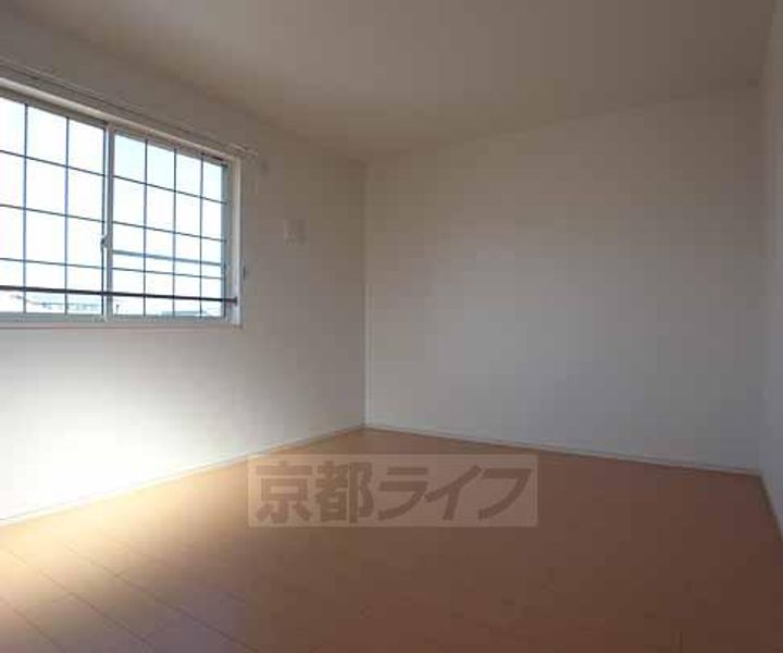 京都府京田辺市東鍵田の賃貸アパートの居間