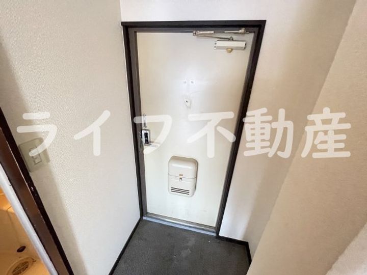 ピースハイツ長堂A棟310の玄関