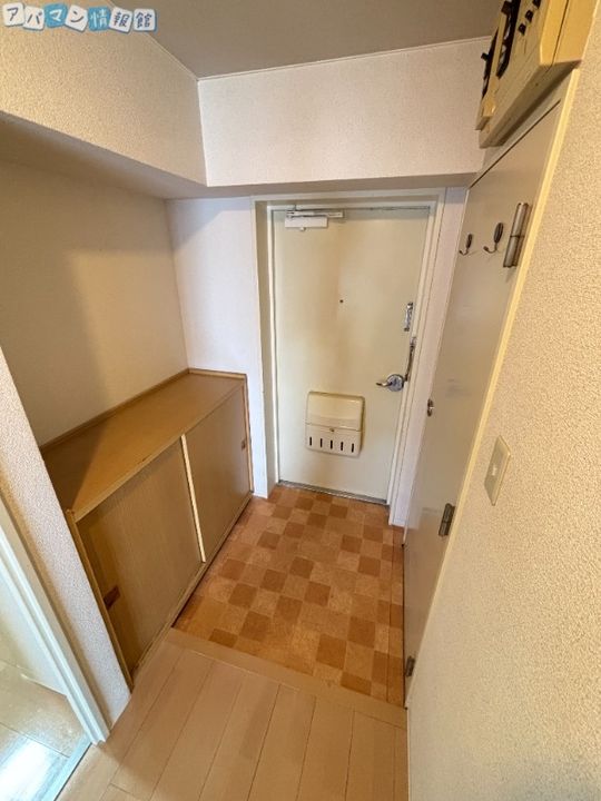 コープ野村万代1316の玄関