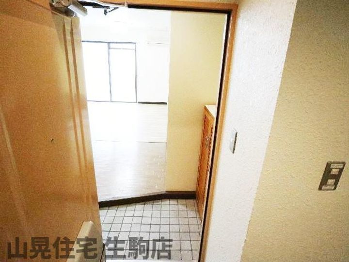 奈良県生駒市元町1丁目(マンション)の賃貸物件304の玄関
