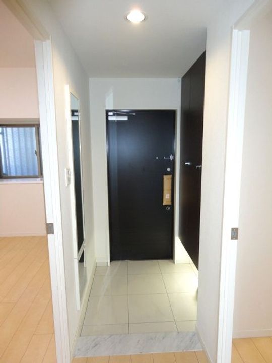 プレミアムステージ久留米中央公園1303号の玄関