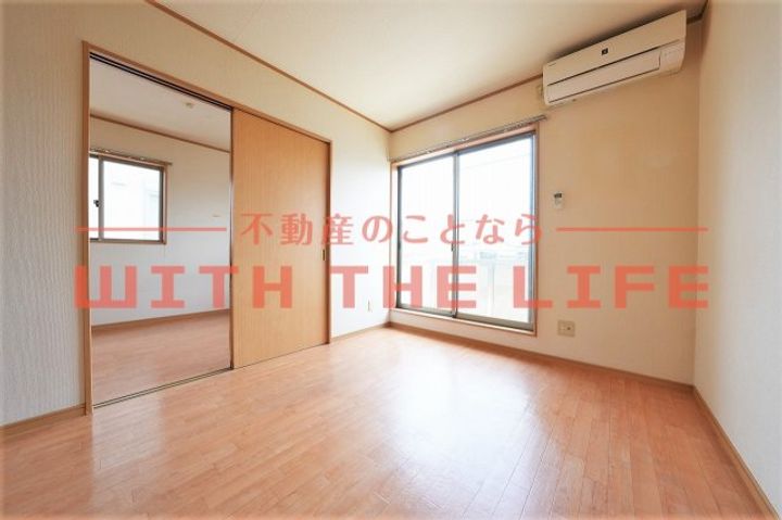 サンリバー大石102号の居間