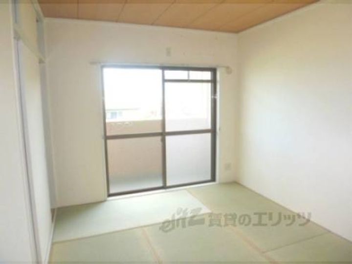 メゾンドール東条202の寝室